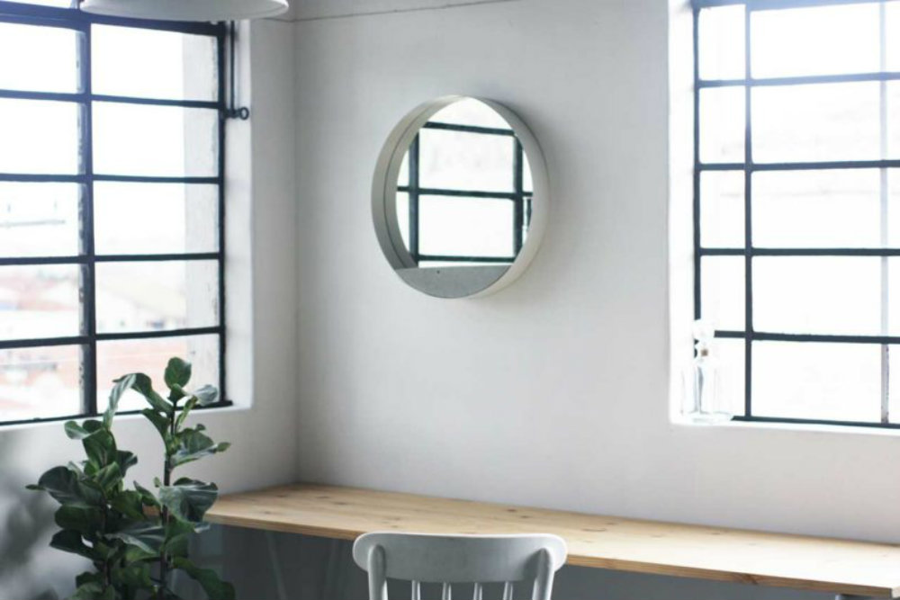 A different wall mirror composed by three materials